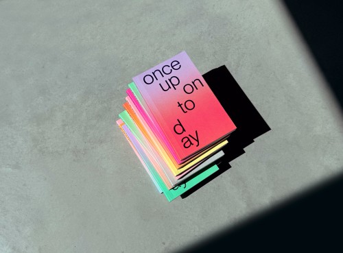 stack of colorfull edition julie joliat planner 2027 on concrete